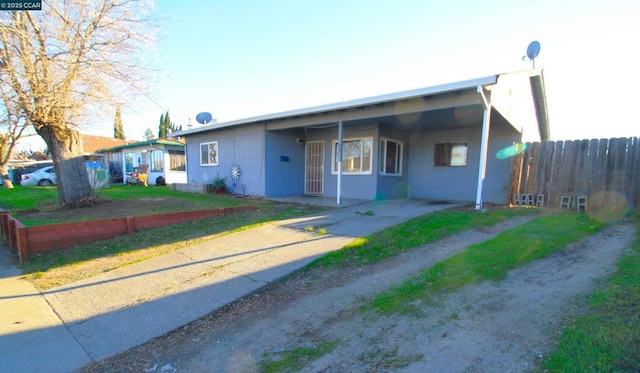 ranch-style house with a carport