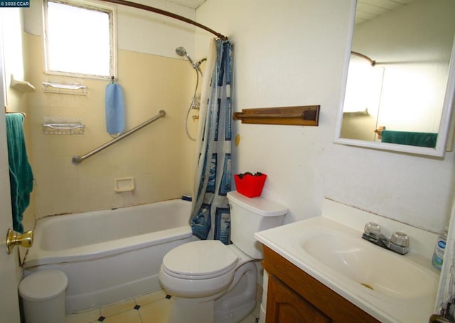 full bathroom featuring tile patterned floors, toilet, vanity, and shower / tub combo with curtain