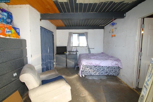 bedroom featuring concrete floors