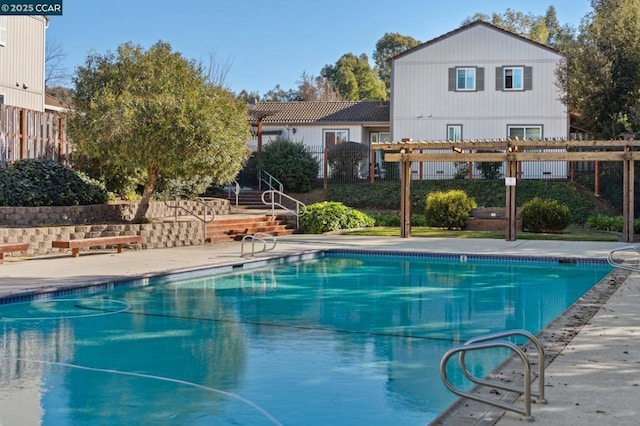 view of pool with a pergola and a patio area