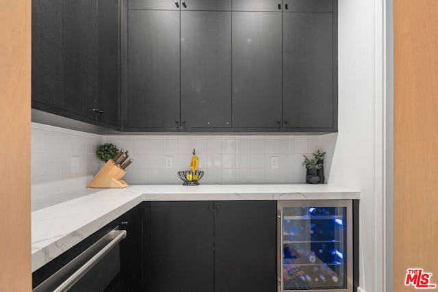 kitchen with decorative backsplash, dishwasher, and beverage cooler