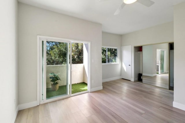 empty room featuring ceiling fan and light wood-type flooring