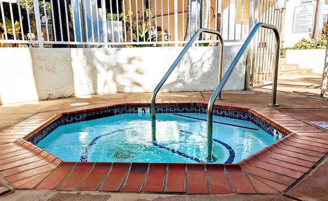 view of pool with a community hot tub