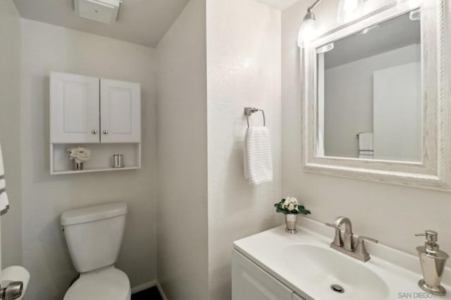 bathroom with toilet and vanity