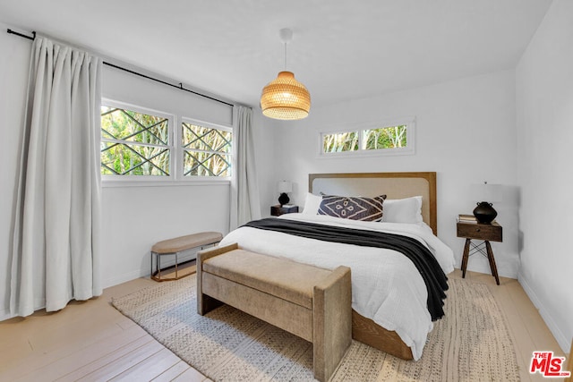 bedroom with light hardwood / wood-style floors