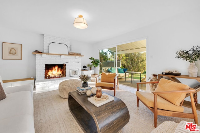 living room featuring a fireplace and light hardwood / wood-style flooring