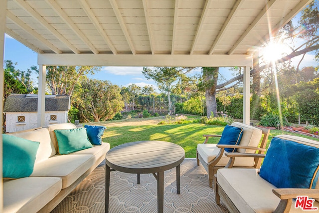 view of patio / terrace featuring a storage shed and outdoor lounge area