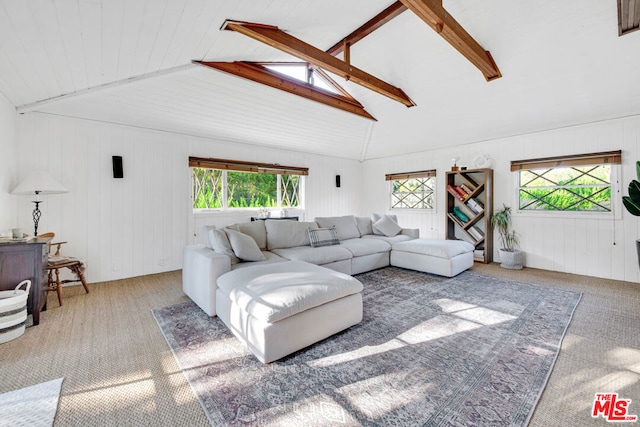 living room featuring carpet floors, vaulted ceiling with beams, and wooden walls