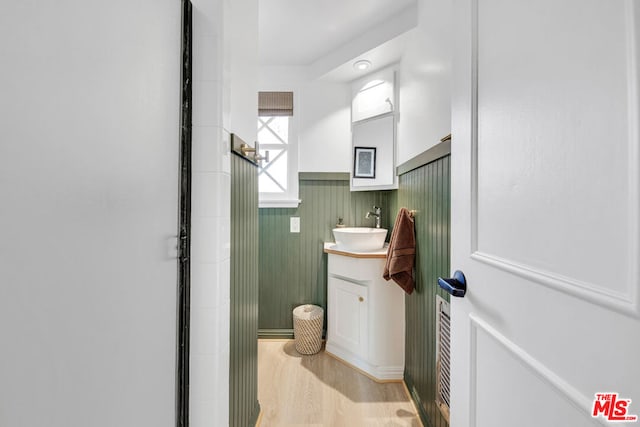 bathroom with vanity and hardwood / wood-style flooring