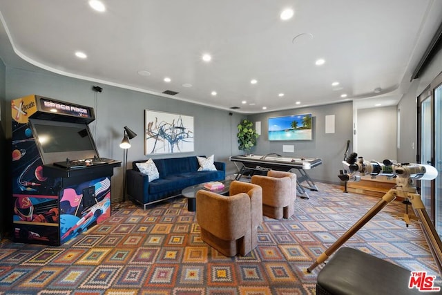 living room featuring dark carpet and ornamental molding