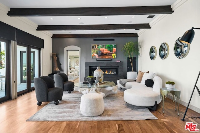 living room featuring wood-type flooring and beam ceiling