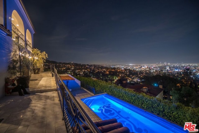 view of pool at night