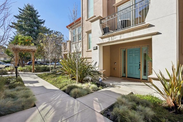 doorway to property featuring a balcony