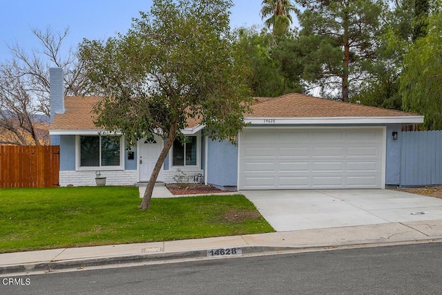 ranch-style home featuring a garage and a front yard