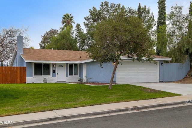 ranch-style house with a garage and a front yard