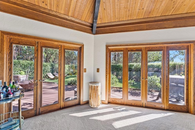 doorway featuring wood ceiling, lofted ceiling with beams, french doors, and carpet flooring