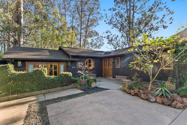 single story home featuring a patio