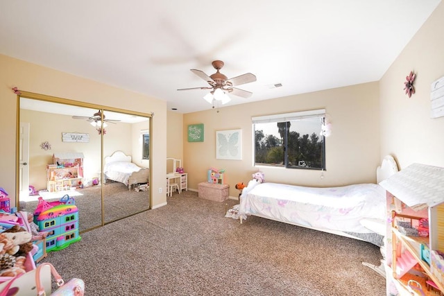 bedroom with ceiling fan, a closet, and carpet