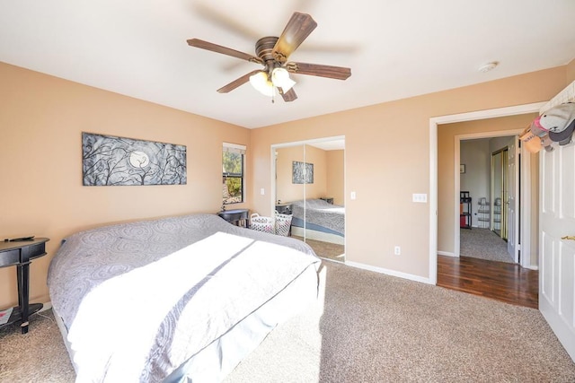 carpeted bedroom with ceiling fan and a closet