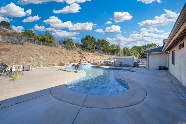 view of swimming pool with a patio