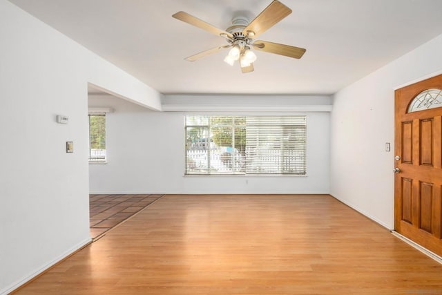 foyer entrance featuring plenty of natural light, light wood-type flooring, and ceiling fan