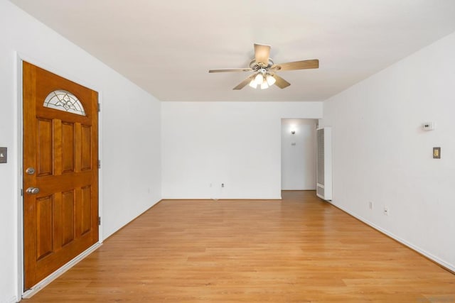 interior space with light wood-type flooring and ceiling fan