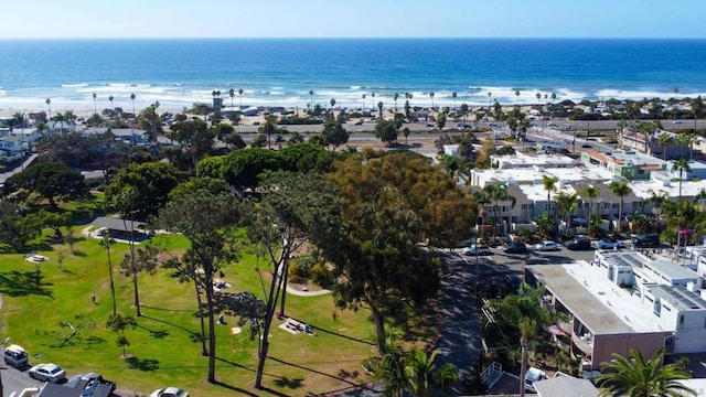 drone / aerial view with a water view and a view of the beach