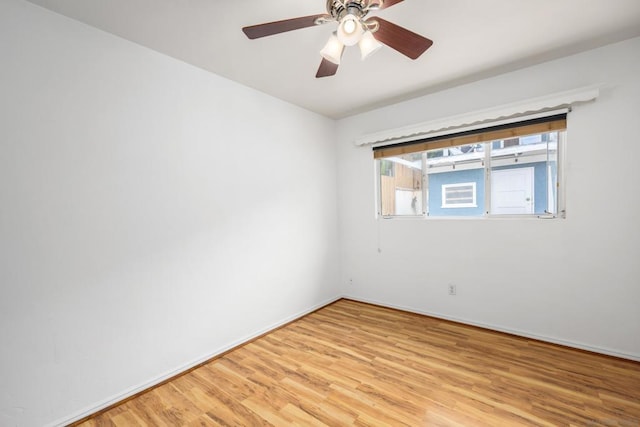 unfurnished room with ceiling fan and light wood-type flooring