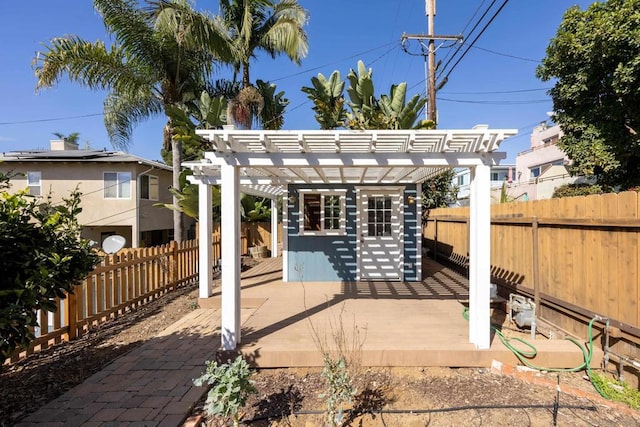 view of patio / terrace featuring an outbuilding and a pergola