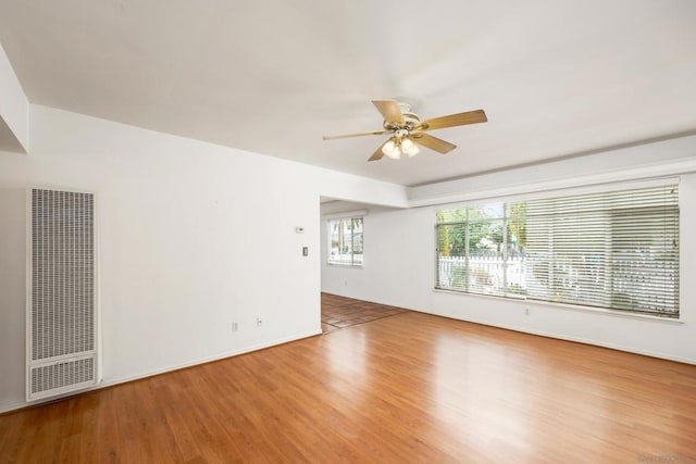 unfurnished room featuring ceiling fan and hardwood / wood-style floors