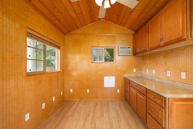 kitchen with light hardwood / wood-style flooring, ceiling fan, wood ceiling, an AC wall unit, and lofted ceiling