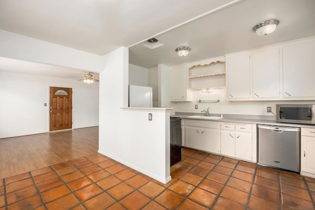 kitchen with sink, white cabinetry, ceiling fan, and appliances with stainless steel finishes