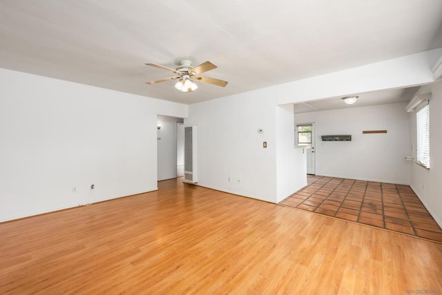 empty room featuring light hardwood / wood-style floors and ceiling fan