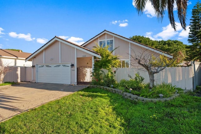 view of front property with a garage and a front yard