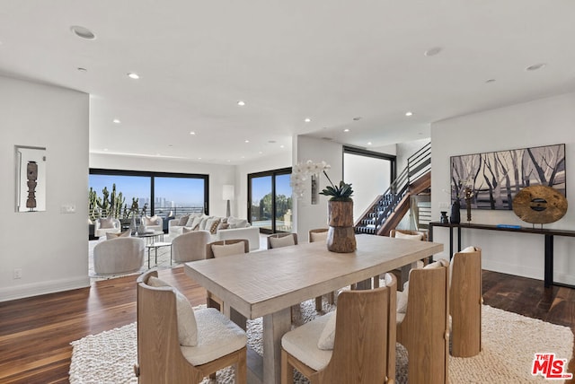 dining space featuring dark hardwood / wood-style floors