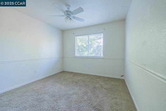 unfurnished room featuring ceiling fan and light colored carpet