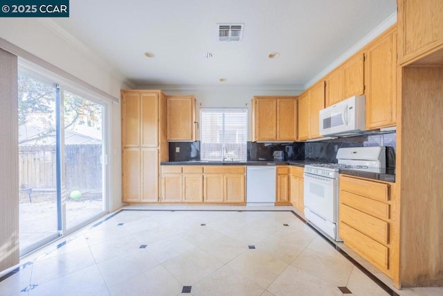 kitchen featuring tasteful backsplash, white appliances, light brown cabinetry, crown molding, and sink