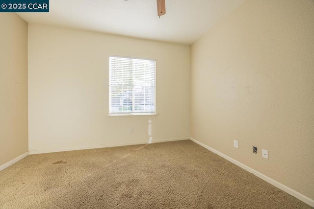 carpeted empty room with ceiling fan