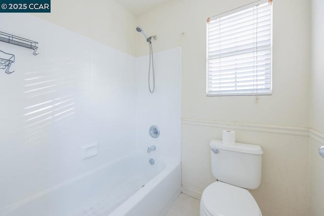 bathroom with toilet, tile patterned flooring, and shower / bathing tub combination