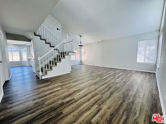 unfurnished living room with lofted ceiling and dark hardwood / wood-style floors