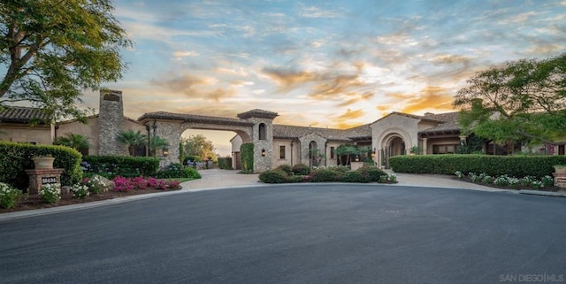 view of outdoor building at dusk