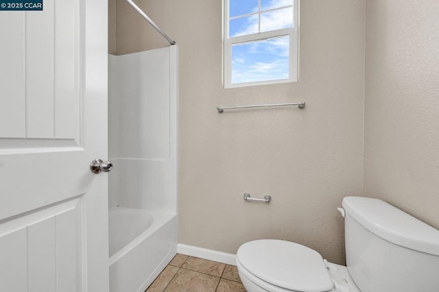 bathroom with toilet and tile patterned floors