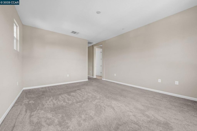 empty room featuring carpet floors