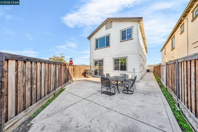 rear view of house with a patio