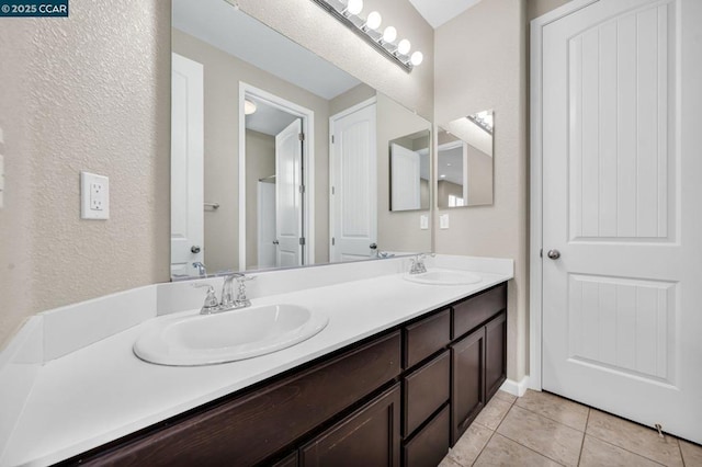 bathroom with vanity and tile patterned flooring