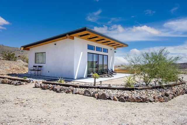 rear view of house with a patio