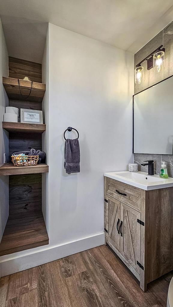 bathroom featuring vanity and hardwood / wood-style flooring