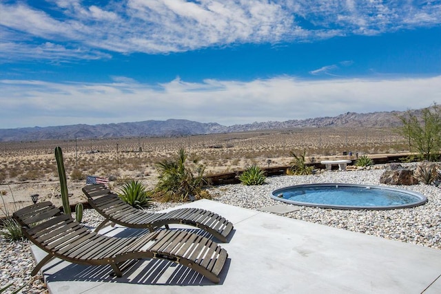 view of pool with a mountain view