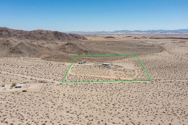 birds eye view of property featuring a mountain view