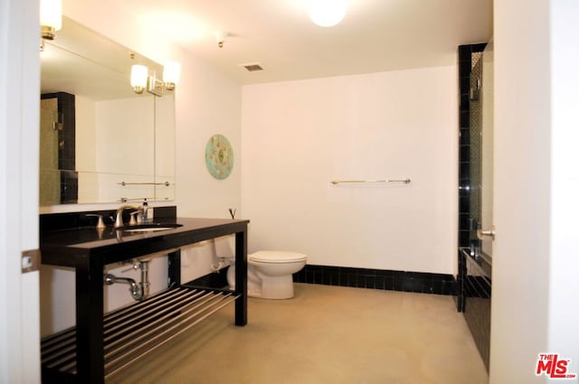 bathroom featuring sink and toilet